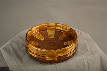 Jim Kuebelbeck used pieces of leftover sumac from the table and black walnut to complete the bowl. Photo: Elena Neuzil.