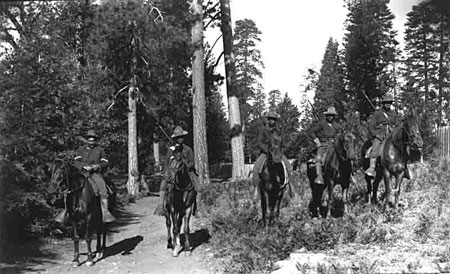 Five U.S. Army soldiers of the 24th Mounted Infantry, mounted on horses in Yosemite National park.