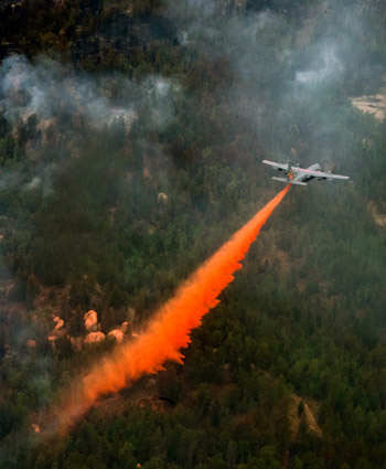 The 153rd Airlift Wing from Cheyenne, Wyo., use a modular air firefighting system-equipped C-130 Hercules aircraft in support of the Waldo Canyon Fire in Colorado Springs, Colo. on June 27, 2012.