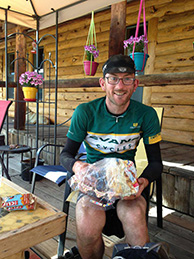 A rider gets food for the road at Brush Mountain Lodge and Outpost. 