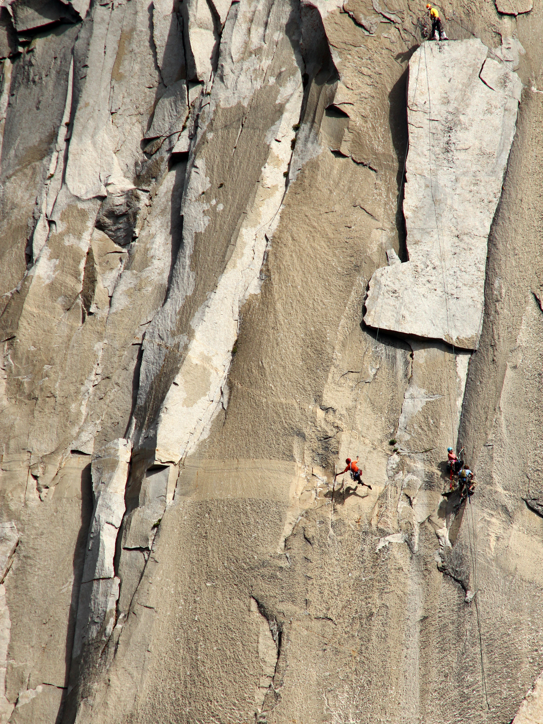 Ben Ditto (orange shirt) runs back and forth to complete the king swing on El Capitan's famous nose route.