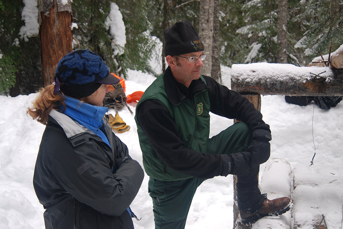 Cathy Raley and John Rohrer converse at the Easy Pass trap site.