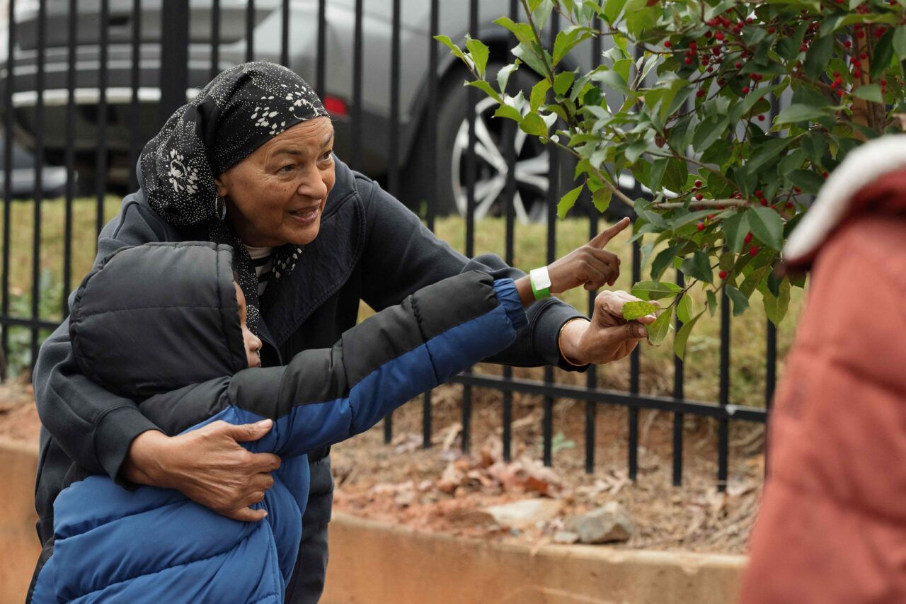 Sister Ali with a young volunteer at a Mohammed Schools of Atlanta tree planting event.
