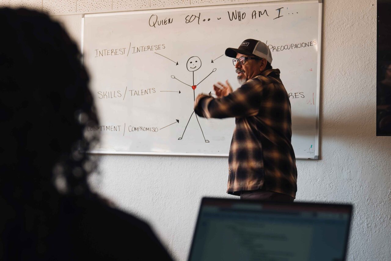 Masavi Perea, a community organizer for nonprofit Unlimited Potential, teaches a workshop on community engagement for the organization's staff and volunteers. The organization focuses on bilingual outreach as an essential part of its strategy.