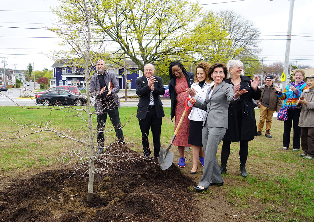 Raimondo volunteers at a tree planting event in Woonsocket, R.I. on Arbor Day 2019.