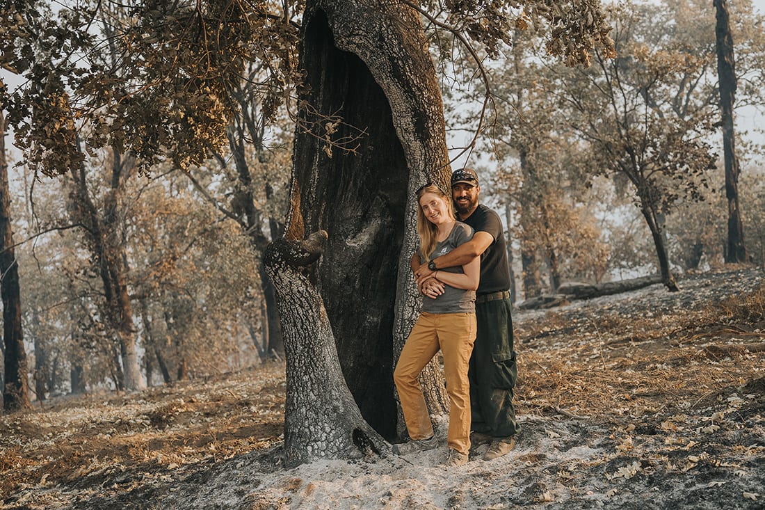 Brittany and Gilbert Dyer stand in the ash of the 2020 Creek Fire, California’s largest-ever single fire.
