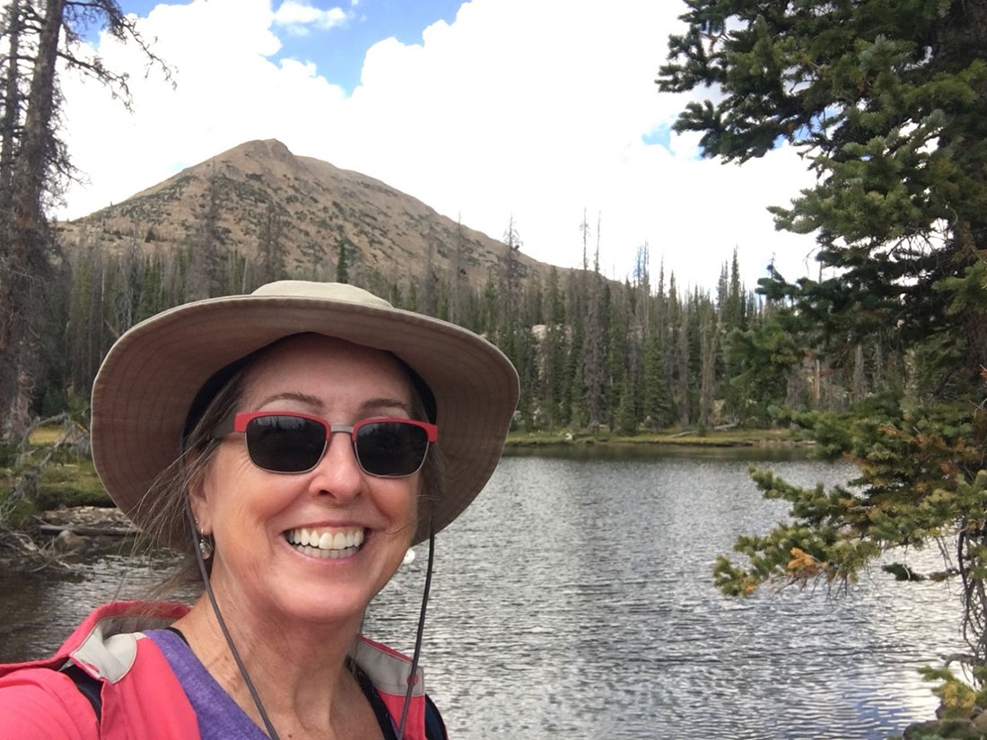 Mary Wagner pauses to take a selfie along the trail to Cliff Lake in August 2020, while on a camping trip in the Wasatch-Cache National Forest in her home state of Utah.