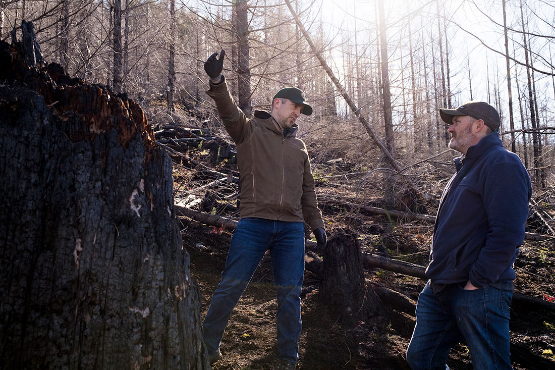 John Walter (left), with the Oregon Department of Forestry, talks with American Forests’ Senior Director of Forest Restoration Brian Kittler at the burn site. Kittler says: “I have a personal love for this landscape and my state, and knowing that they were going to be financially challenged, we were in a position to help.”
