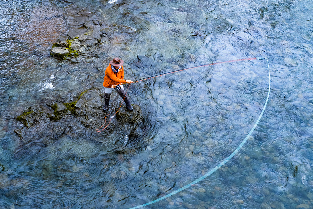 A fly fisherman spey casting on the Wilson River near the Tillamook Forest Center, an area devastated by the Tillamook Burn over 70 years ago but has since rebounded.