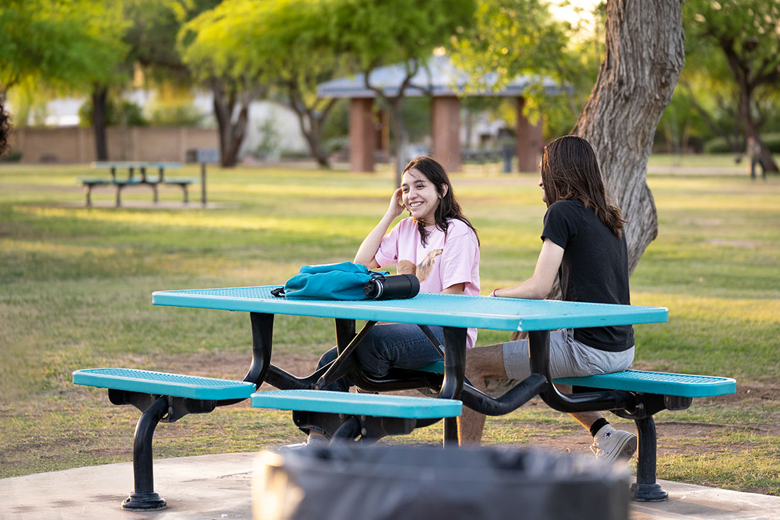 Arizona State University film students gather at a park to collaborate on a film project.