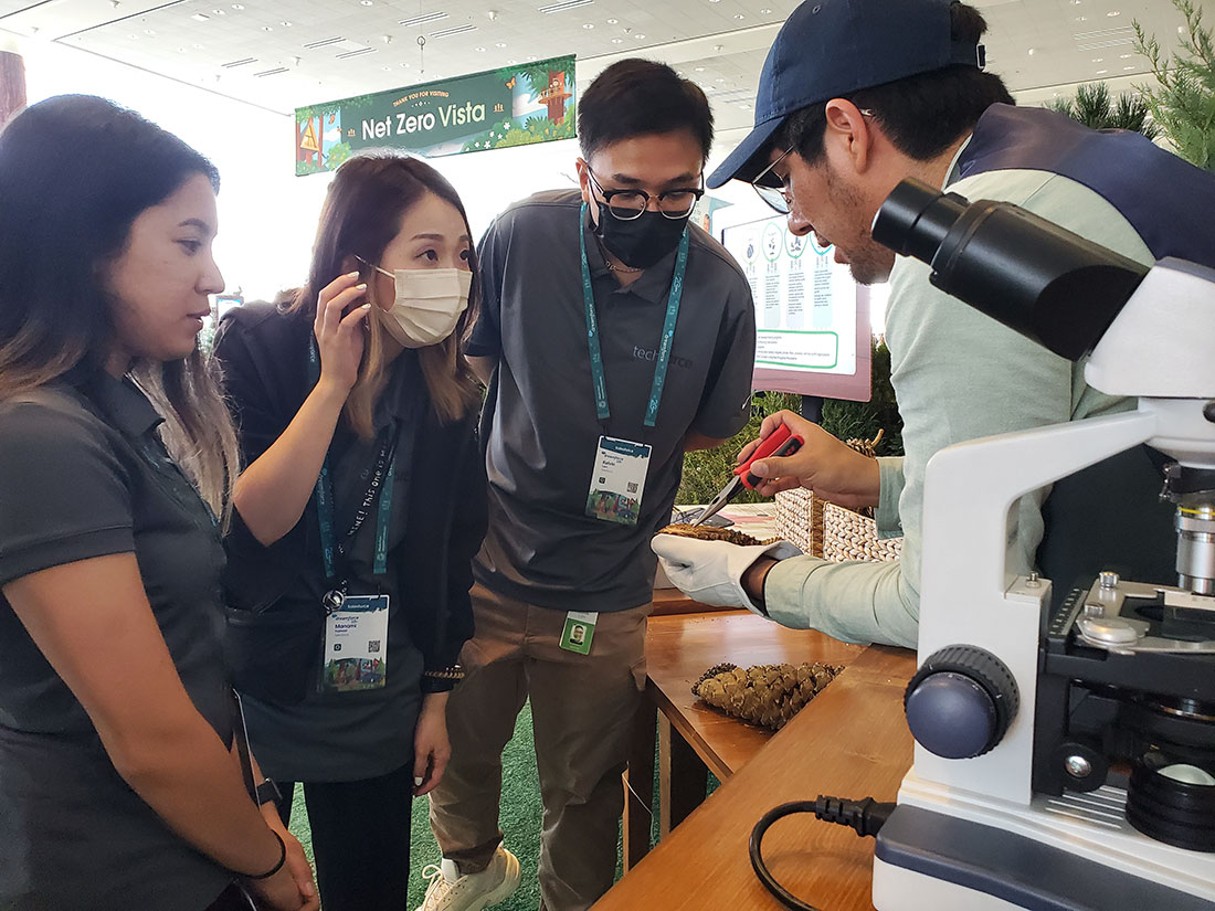 Vidal demonstrates how to analyze sugar pine cones during Dreamforce 2022 sponsored by Salesforce. The event was one of several ways American Forests raised awareness about the nationwide seed shortage during Seed September.