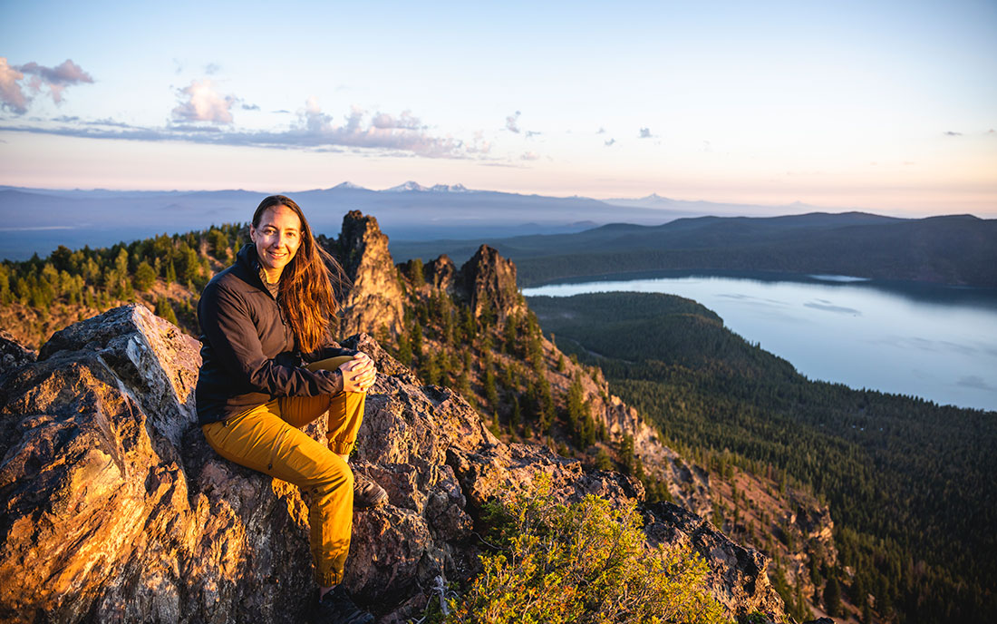 Pansing sits at the summit of Oregon’s Paulina Peak, surrounded by her beloved whitebark pines, which she describes as “magical.”