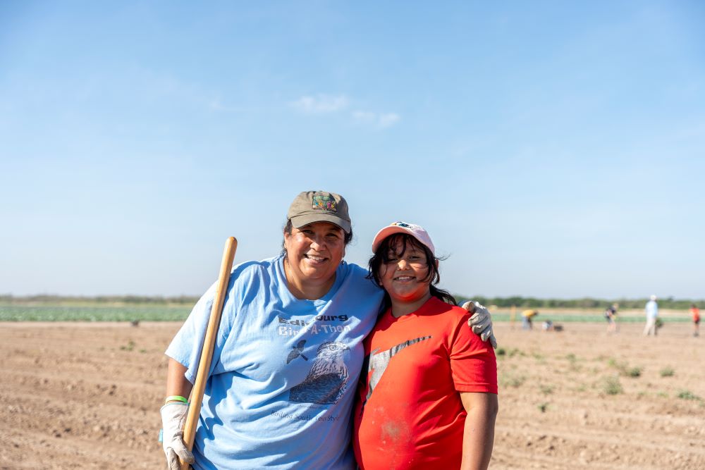 Marisa Oliva and her daughter, Julia, smile and pose during a break from planting. This was Julia’s first time attending Rio Reforestation. Jeremy Inglesi Jr. / American Forests