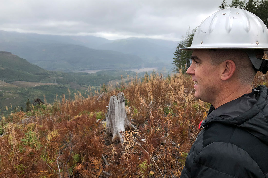Washington State Department of Natural Resources Regional Silviculturalist Brian Williams looks out across the Green River watershed from a replanted timber harvest unit.