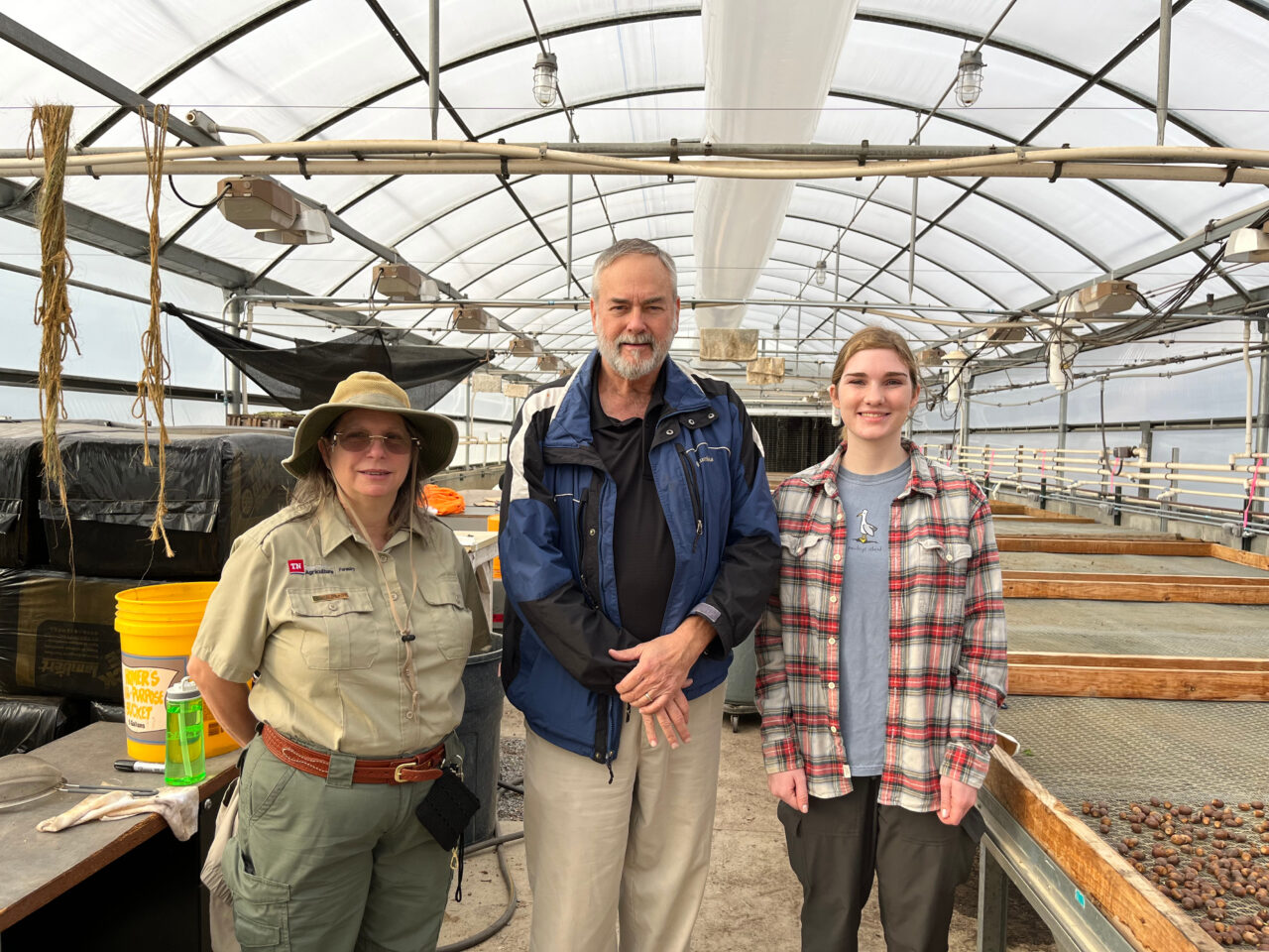 (From L to R) Laura Dowdy with the East Tennessee Seedling Nursery, Director of the UT Tree Improvement Program Scott Schlarbaum, and Victorson at the state nursery. Mitzy Sosa / American Forests