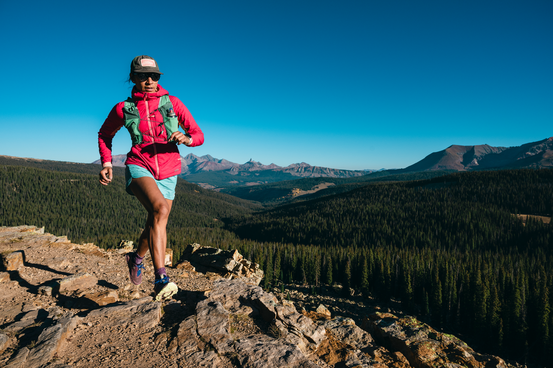 Dani Reyes-Acosta running at Bolam Pass, above the headwaters of the Dolores River. San Juan National Forest, Colorado. CREATOR Matthew Tangeman