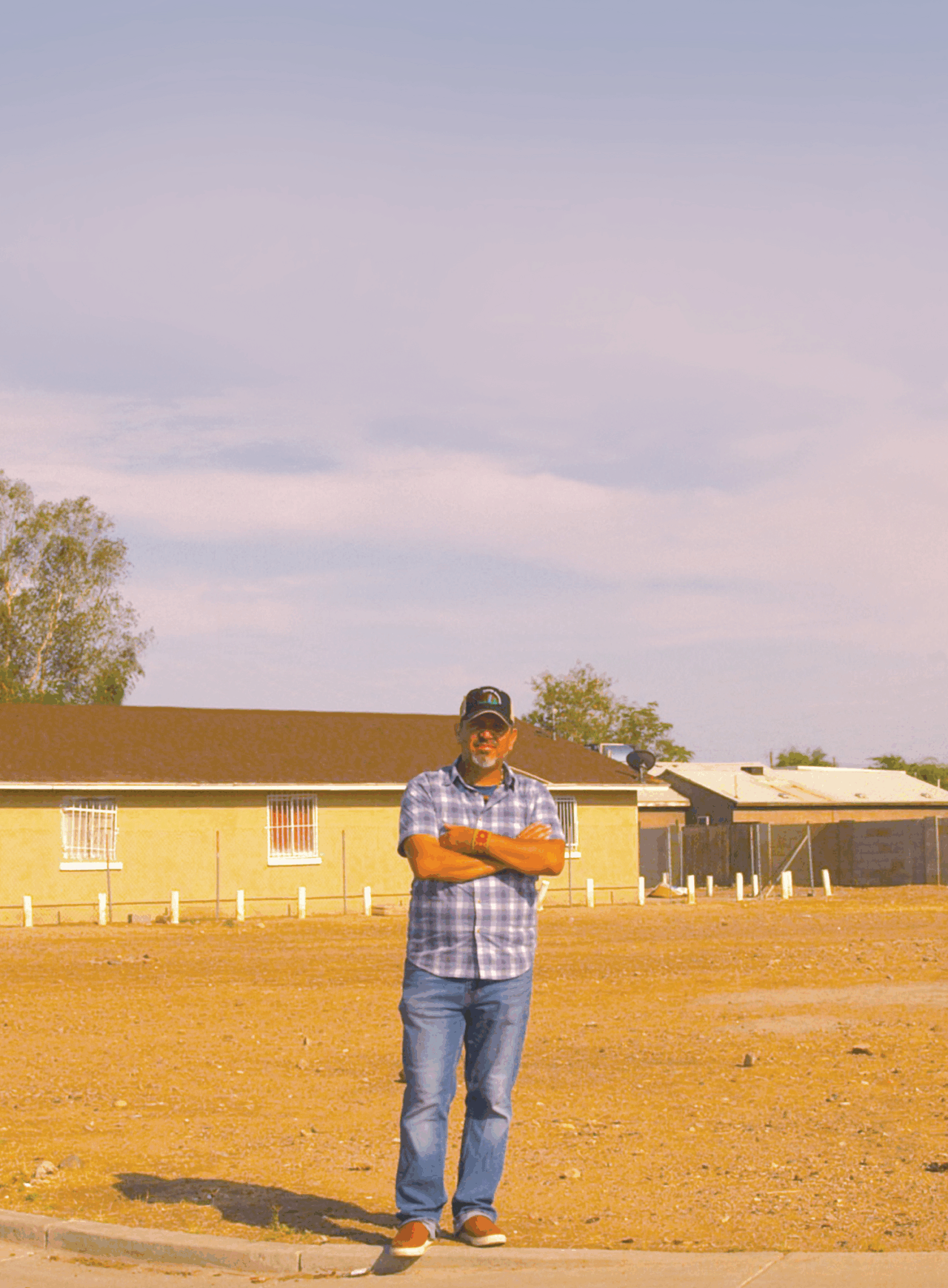Masavi Perea stands in front of an empty lot in South Phoenix. This image was used on the Fall 2021 American Forests magazine issue. CREATOR American Forests DATE CREATED (empty) USAGE/RESTRICTION Photo Credit: American Forests / Joel Clark