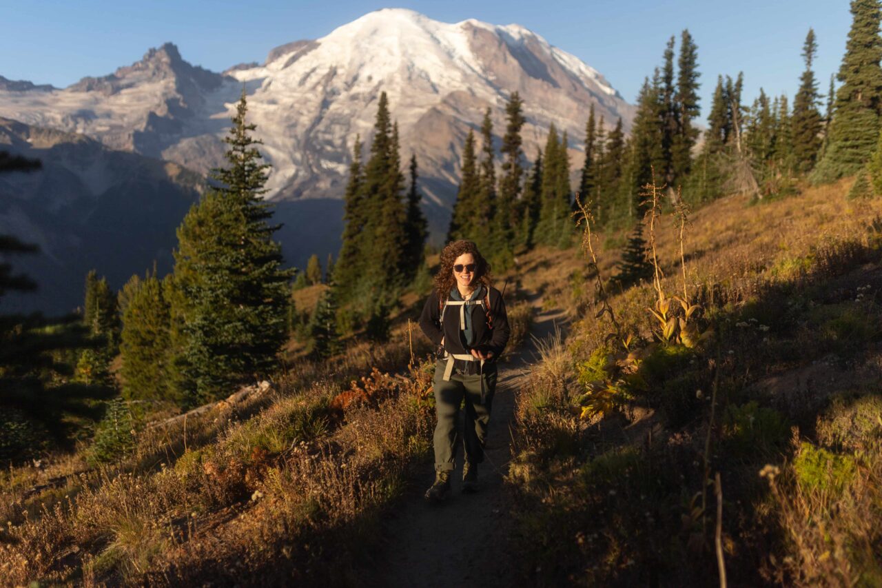 Eve Bernhard, restoration ecologist in a dual role with American Forests and the National Park Service, heads out on a 2-mile hike to her restoration site in Mount Rainier National Park.