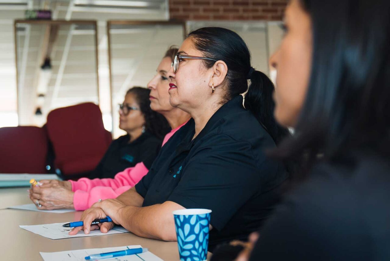 Perea teaches a workshop on community engagement for the organization's staff and volunteers. The organization focuses on bilingual outreach as an essential part of its strategy.